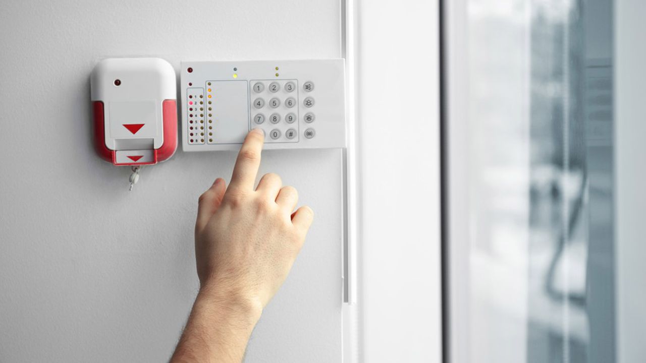 Security Alarm Keypad With Male Hand, Closeup